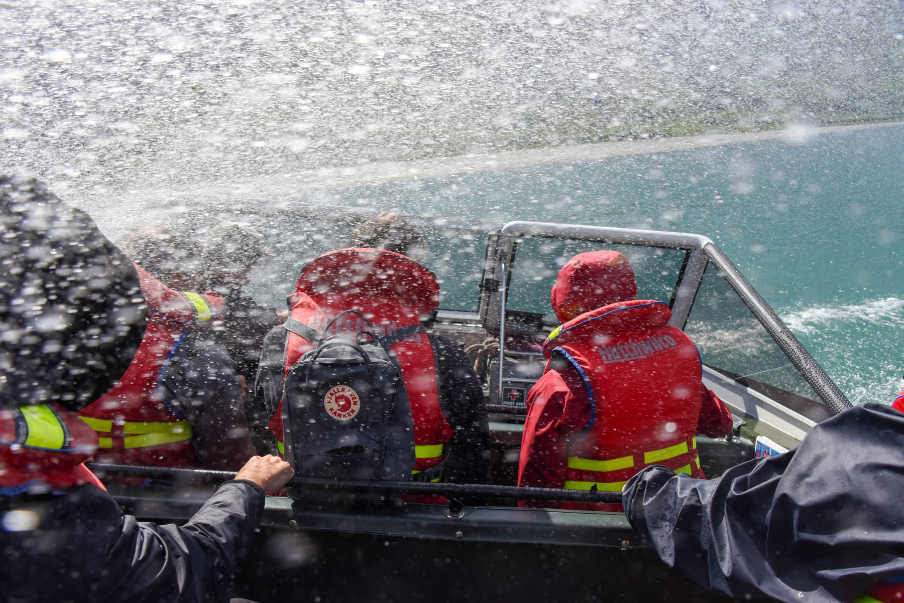 Spray over the jet boat as it turns on the Matukituki River
